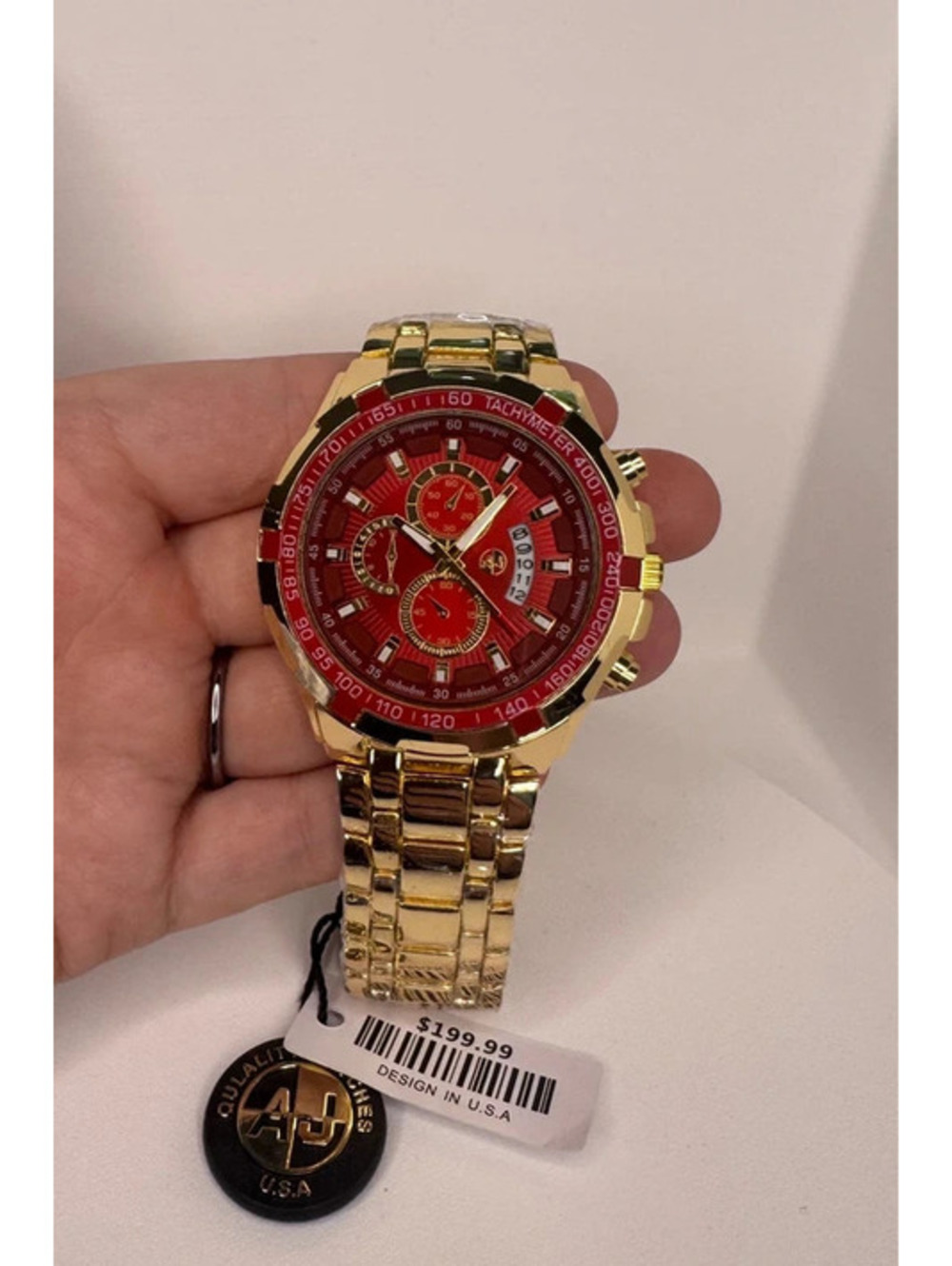 AJ sport’s master gold tone stainless steel watch red dial 48mm (READ)